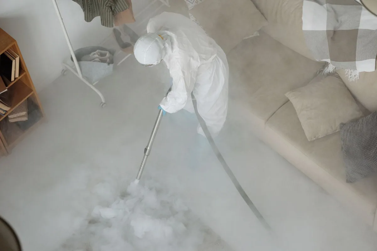 Biohazard cleanup technician in protective equipment, Gravesend (South), New York, NY